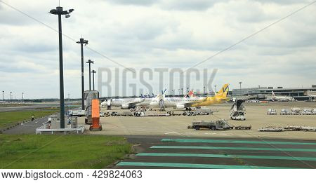 Narita, Japan - May, 2018 : Narita International Airport View, Airplane Parking At Parking Bay. Serv