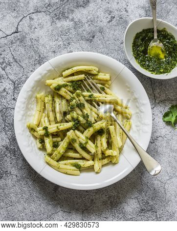 Casarecce Pasta With Cilantro Pesto Sauce On A Grey Background, Top View. Delicious Vegetarian Lunch