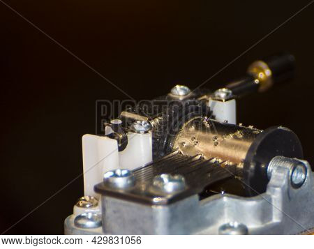 Details Of A Miniature Music Playing Hurdy-gurdy