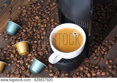 Automatic Coffee Machine With Coffee Capsules Or Pods Pouring Espresso Drink. Making Coffee In A Cof