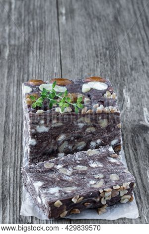 Handmade  Chocolate Sherbet With Nuts Isolated On Rustic Wooden Table