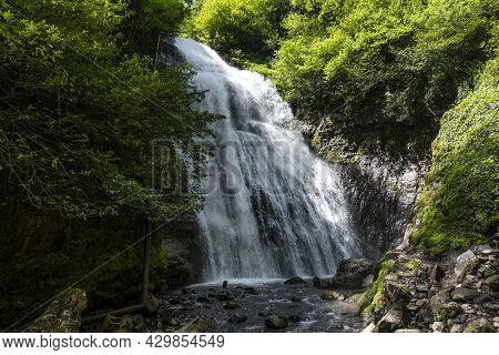Irina Waterfall In The Republic Of Abkhazia. A Clear Sunny Day On May 20, 2021