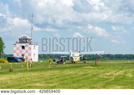 Gorodok.ukraine. June 6, 2021. Tsuniv Airfield. Tsuniv Airfield. A Group Of People Boarding A Plane 