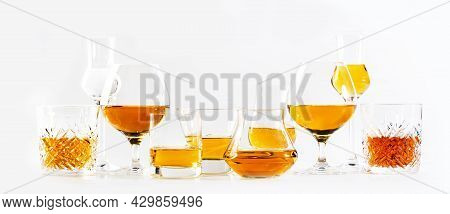 Strong Alcohol Drinks, Hard Liquors, Spirits And Distillates Iset In Glasses: Cognac, Scotch, Whiske