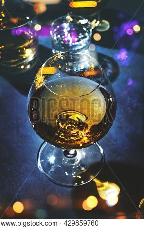 Strong Alcohol Drinks, Hard Liquors, Spirits And Distillates Iset In Glasses: Cognac, Scotch, Whiske