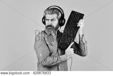 Online Cyber E-sport Internet. Gamer Playing Computer Game. Digital Music Creation. Bearded Man Head