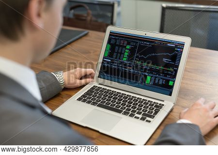 Young Businessman Working With Laptop, Mans Hands On Notebook Computer.