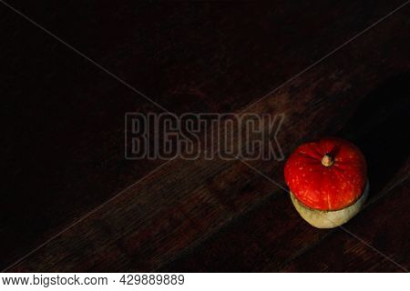 Flat Lay Top View Turban Squash, Cucurbit On Dark Wooden Background. Turkish Pumpkin With A Turban. 