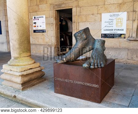 Santiago De Compostela, Spain - September 13, 2020:
Feet Sculpture With Medical Plaster Near The Cat