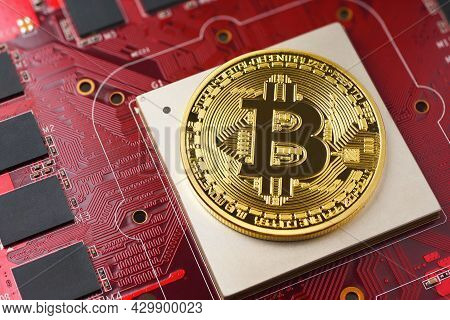 Golden Bitcion Coin On The Gpu Graphic Card Chip. Cryptocurrency Mining Concept.