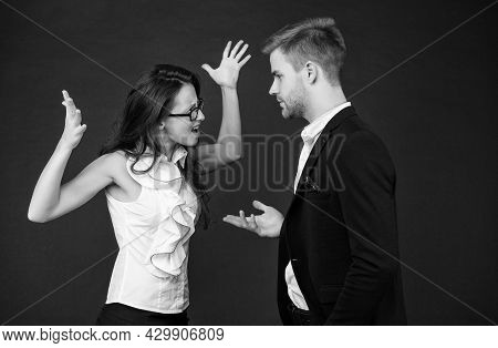 Disagreement Among Colleagues. Emotional Woman And Man Fight Dark Background. Professional Or Person
