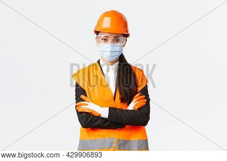 Covid-19 Safety Protocol At Enterpise, Construction And Preventing Virus Concept. Confident Asian Fe