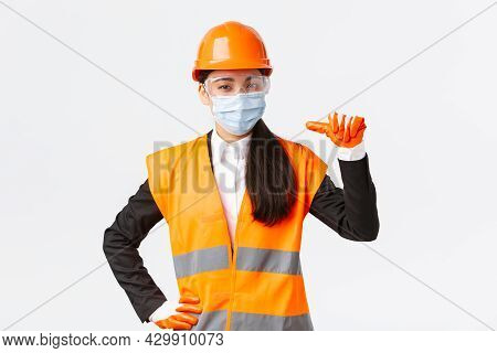 Covid-19 Safety Protocol At Enterpise, Construction And Preventing Virus Concept. Confident Asian Fe