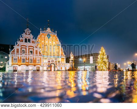 Riga, Latvia. Panorama Of Town Hall Square, Popular Place With Famous Landmarks On It In Bright Even