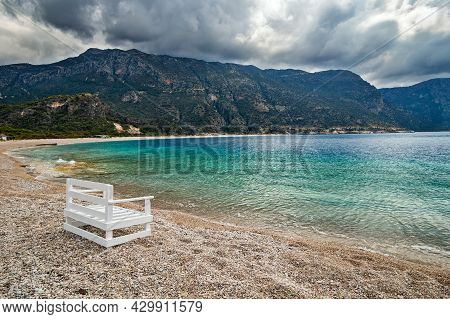 Empty Oludeniz Beach Out Of Season On The Background Of The Mountains In Pre-thunderstorm Weather. M