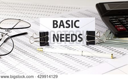 Word Writing Text Basic Needs On White Sticker On Chart Background. Business