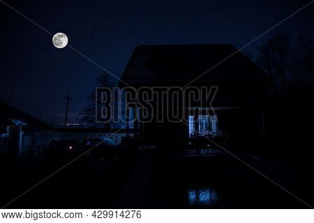 Old House With A Ghost In The Forest At Night Or Abandoned Haunted Horror House In Fog. Old Mystic B