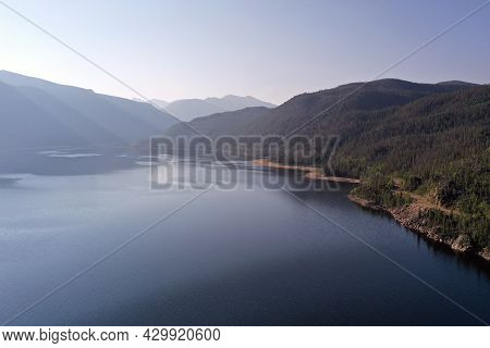Aerial View Of Lake Granby, Colorado And Surrounding Mountains And Forests On Clear Calm Summer Morn
