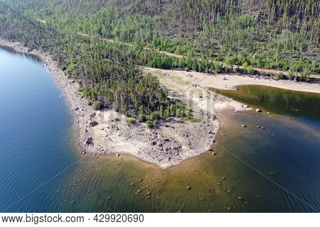 Aerial View Of Lake Granby, Colorado And Surrounding Mountains And Forests On Calm Sunny Summer Morn