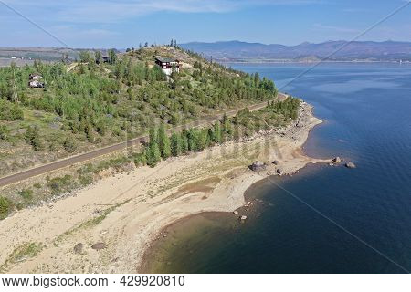 Aerial View Of Lake Granby, Colorado And Surrounding Mountains And Forests On Calm Sunny Summer Morn