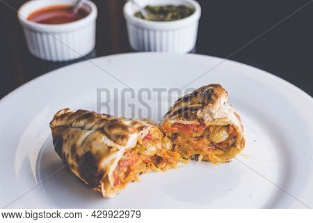 Traditional Argentinian Food Called Empanada On A Black Background