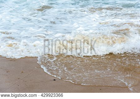 Waves Lapping The Sands Of Ponta Do Humaitá Beach.