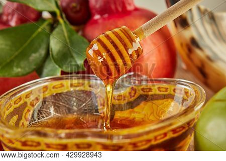 Rosh Hashanah - Jewish New Year Holiday Concept. A Bowl In The Shape Of An Apple With Honey, Pomegra