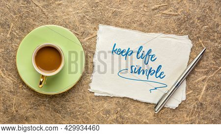 keep life simple  inspirational writing - reminder note on a handmade paper with coffee, simplicity, minimalism and lifestyle concept