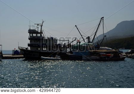 Boats and yachts at the in the marina of village Akyaka - slow city in Turkey.August 1,2021. Mugla,Turkey