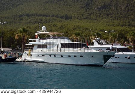 Boats and yachts at the in the marina of village Akyaka - slow city in Turkey.August 1,2021. Mugla,Turkey