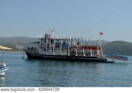 Boats and yachts at the in the marina of village Akyaka - slow city in Turkey.August 1,2021. Mugla,Turkey