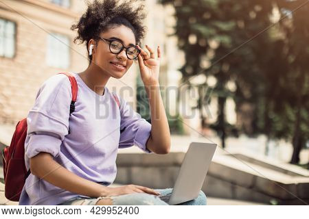 African American Student Girl Posing With Laptop Wearing Eyeglasses Outside