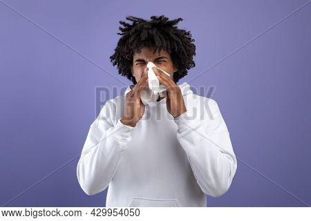 Cold And Flu. Sick Black Teenager Sneezing In Paper Tissue, Suffering From Rhinitis Or Sinusitis On 