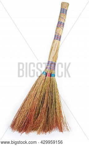 Short Handle Broom Made With Natural Sorghum Tassels Stands On A White Background, Close-up