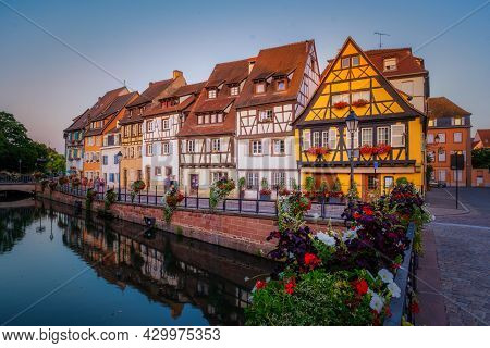 Colmar, Alsace, France. Petite Venice, Water Canal, And Traditional Half Timbered Houses. Colmar Is 