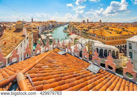 Rialto Bridge Above Grand Canal. View From Rooftop Lookout Terrace Of The Fondaco Dei Tedeschi. Veni