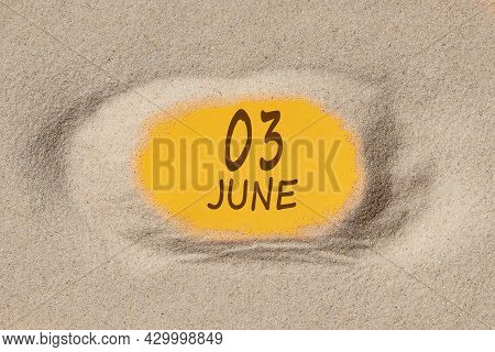 June 3 . 3th Day Of The Month, Calendar Date. Hole In Sand. Yellow Background Is Visible Through Hol