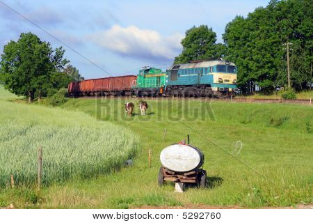 Cottage Scene With A Freight Train