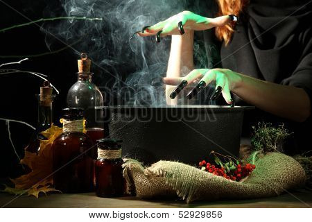  Witch in scary Halloween laboratory on dark color background