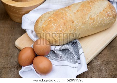 Loaf Of Sourdough Bread In Rustic Kitchend Setting