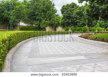 Stone Pathway In A Lush Green Park