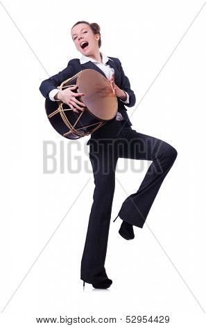 Funny businesswoman with drum isolated on white