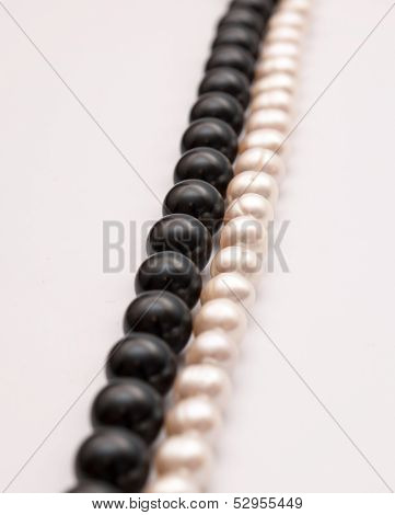 Rows of black and white pearls