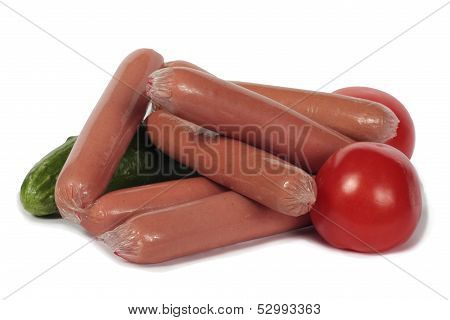 Sausages, cucumbers and tomatoes isolated on a white background.