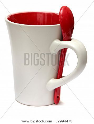 ceramic mug with a red spoon