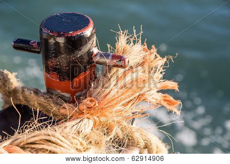 Frayed Rope On Rusty Cleat