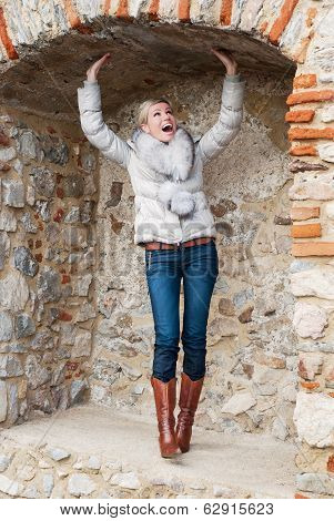 Beautiful Blond Woman Posing In Brick Niche