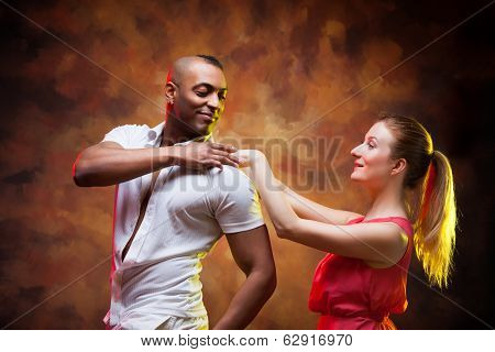 Young couple dances Caribbean Salsa