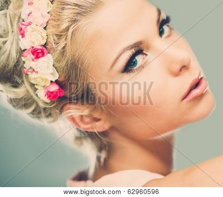 Beautiful young dreaming woman with chaplet 