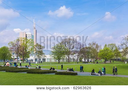 HANOVER, GERMANY - APRIL 7:  Visitors of Hannover Messe in the park. April 7, 2014. The Hannover Messe is the largest industrial trade fair in the world